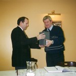 1999 Chairman Brendan Knox presents a piece of Waterford Crystal to Jim Hennessey