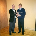 1999 Chairman Brendan Knox presents a piece of Waterford Crystal to Jim Hennessey.